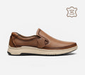 Brown leather slip-on shoe on a white background with 'Genuine 100% Leather' label.