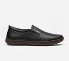 Black slip-on shoe with brand logo on a white background
