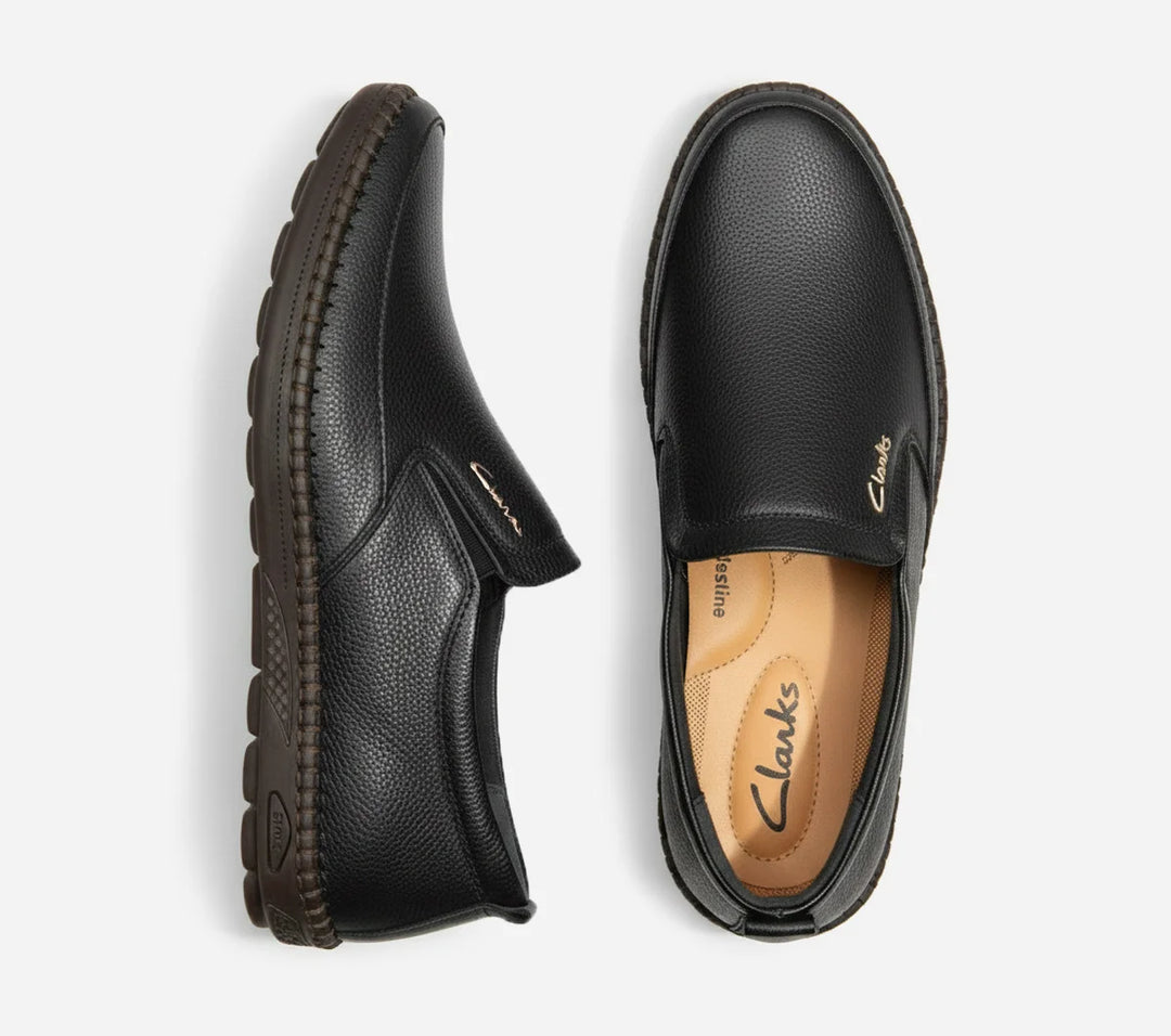 Pair of black leather shoes on a white background
