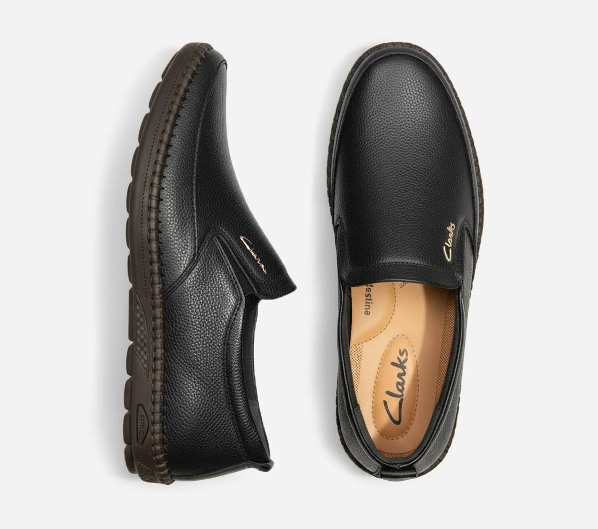 Pair of black leather shoes on a white background