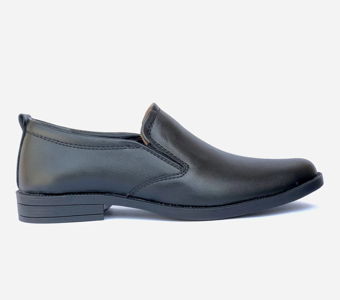 Black slip-on shoe on a white background
