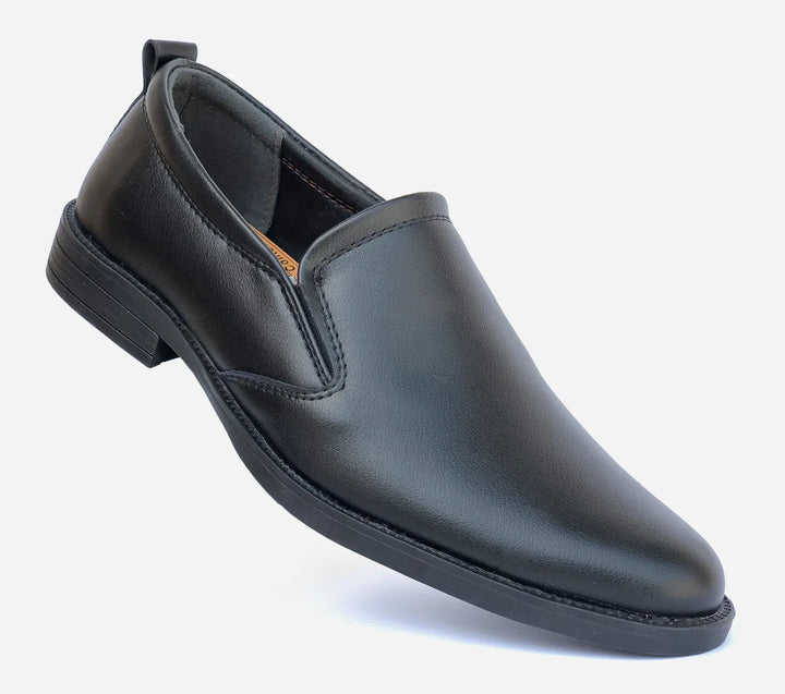 Black slip-on shoe on a white background