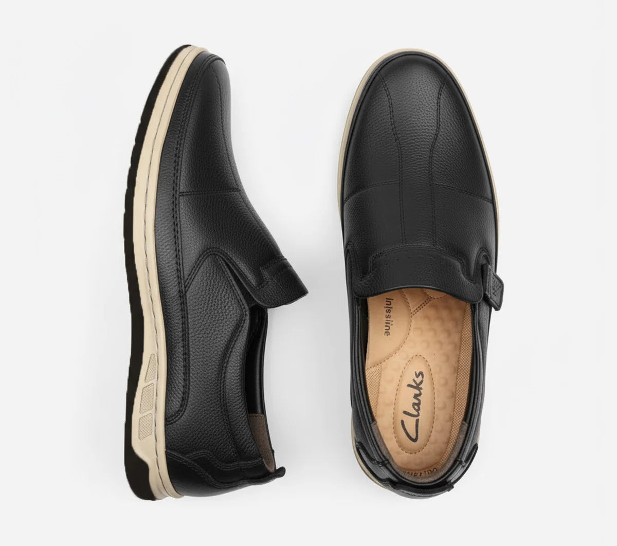 Black slip-on shoes with 'Clarks' branding on a white background