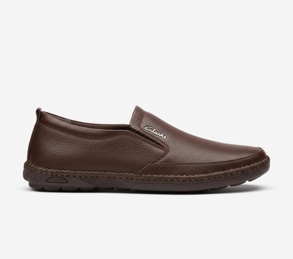 Brown slip-on shoe with 'Clarks' branding on a white background