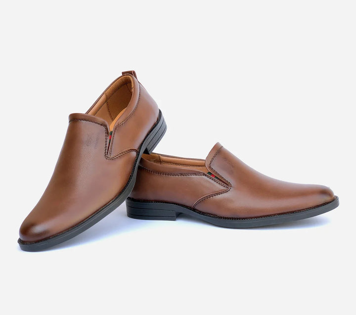 Pair of brown leather shoes on a light gray background