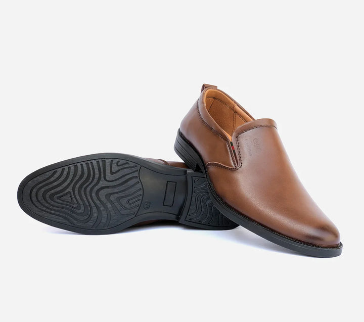 Brown leather shoe with black sole on a white background