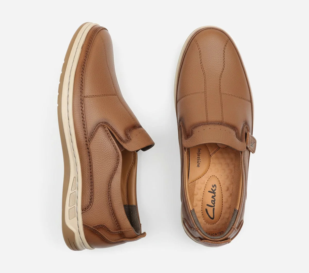 Pair of tan loafers on a white background
